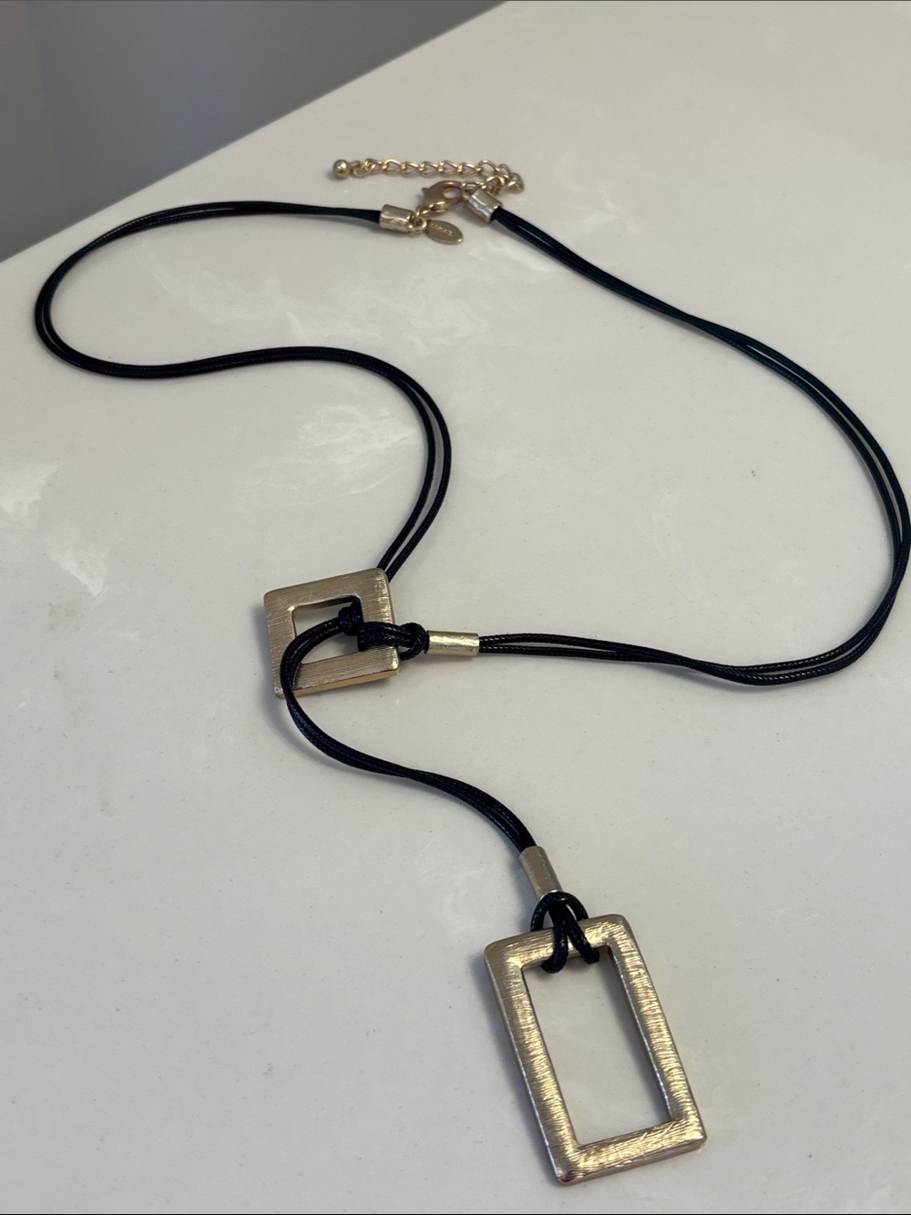 Chico’s Minimalist Black Leather Lariat Necklace with Gold Rectangular Pendant
